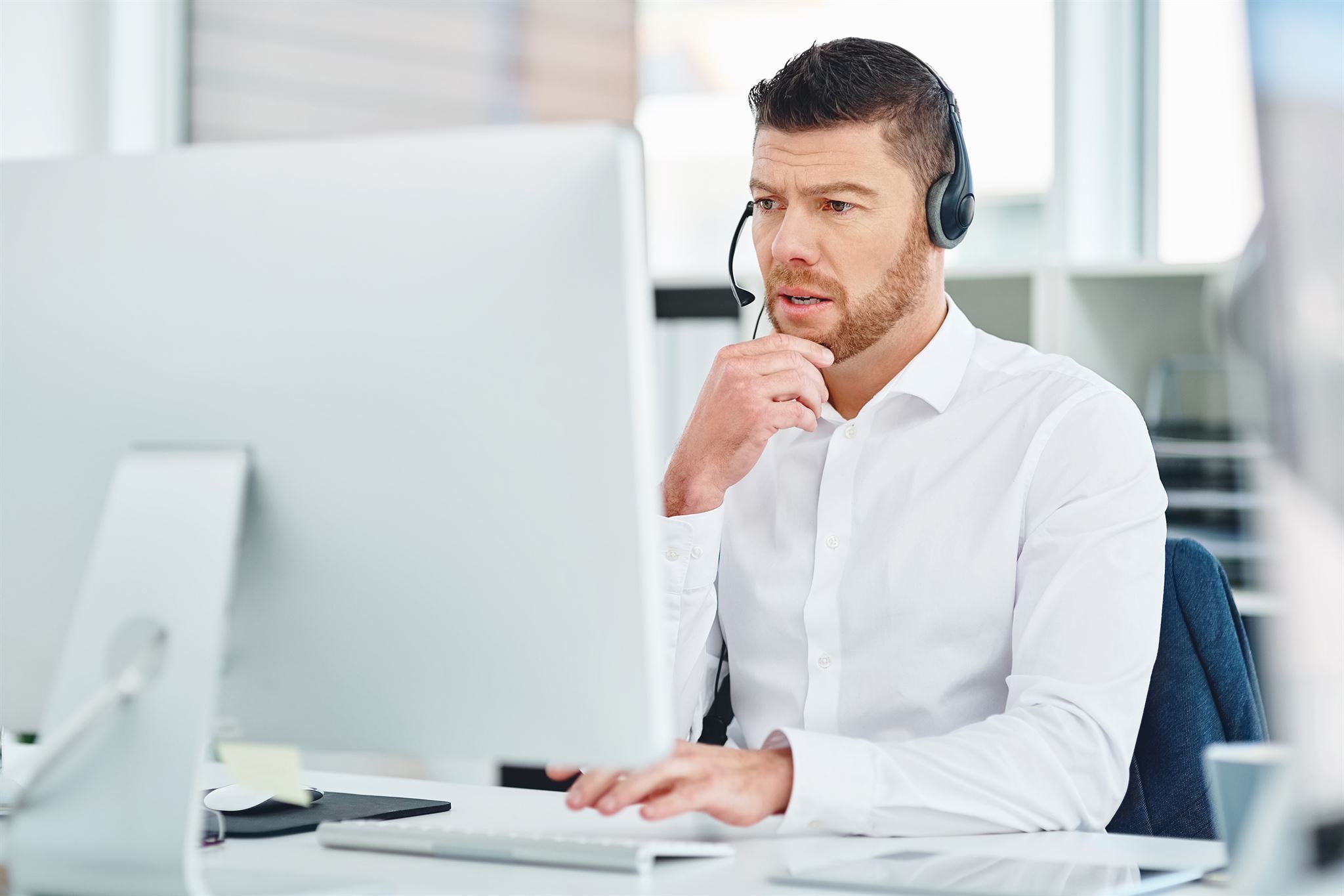 Person using headset with TeamsLink adapter