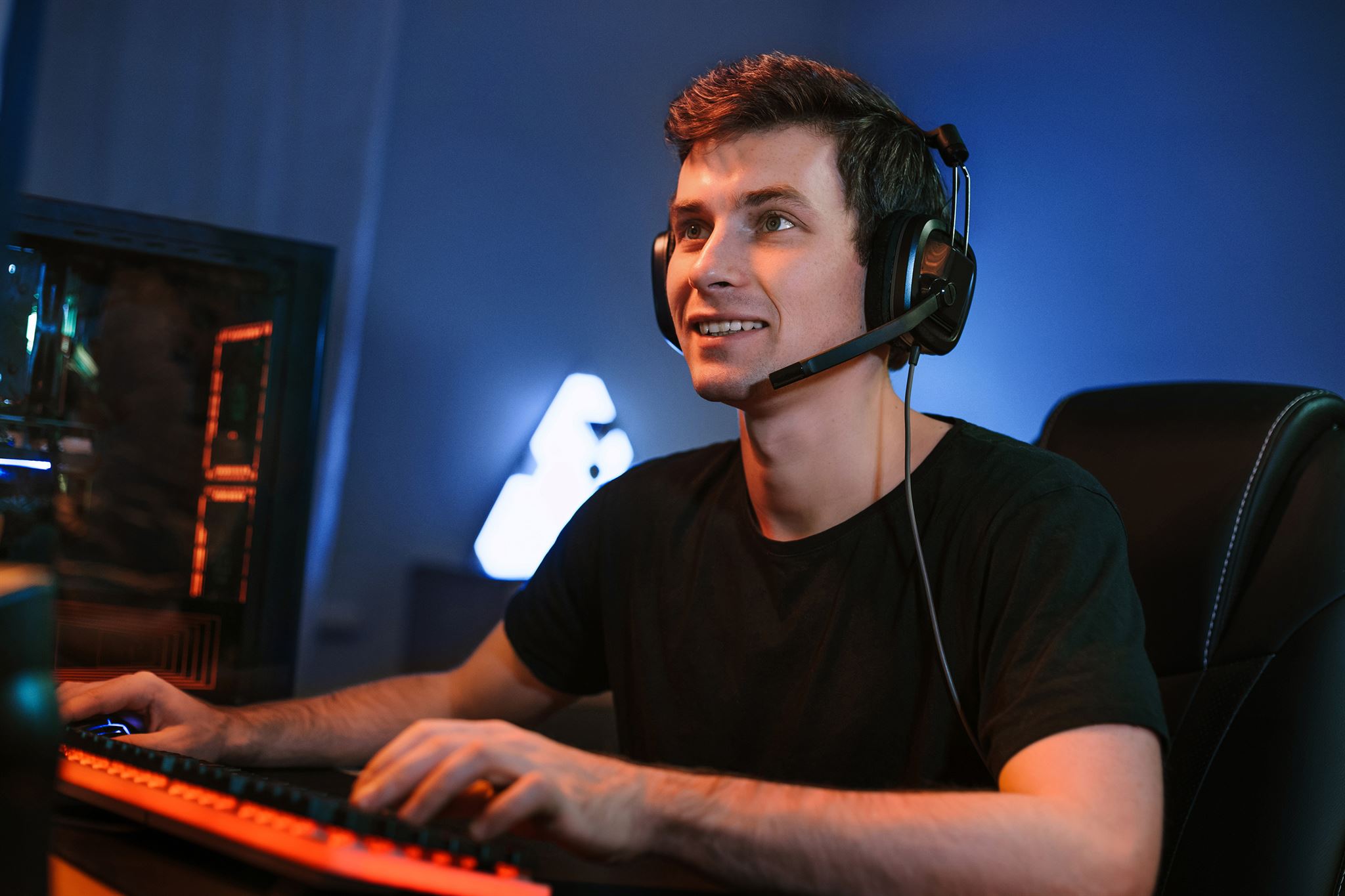 Professional working in open office wearing headset